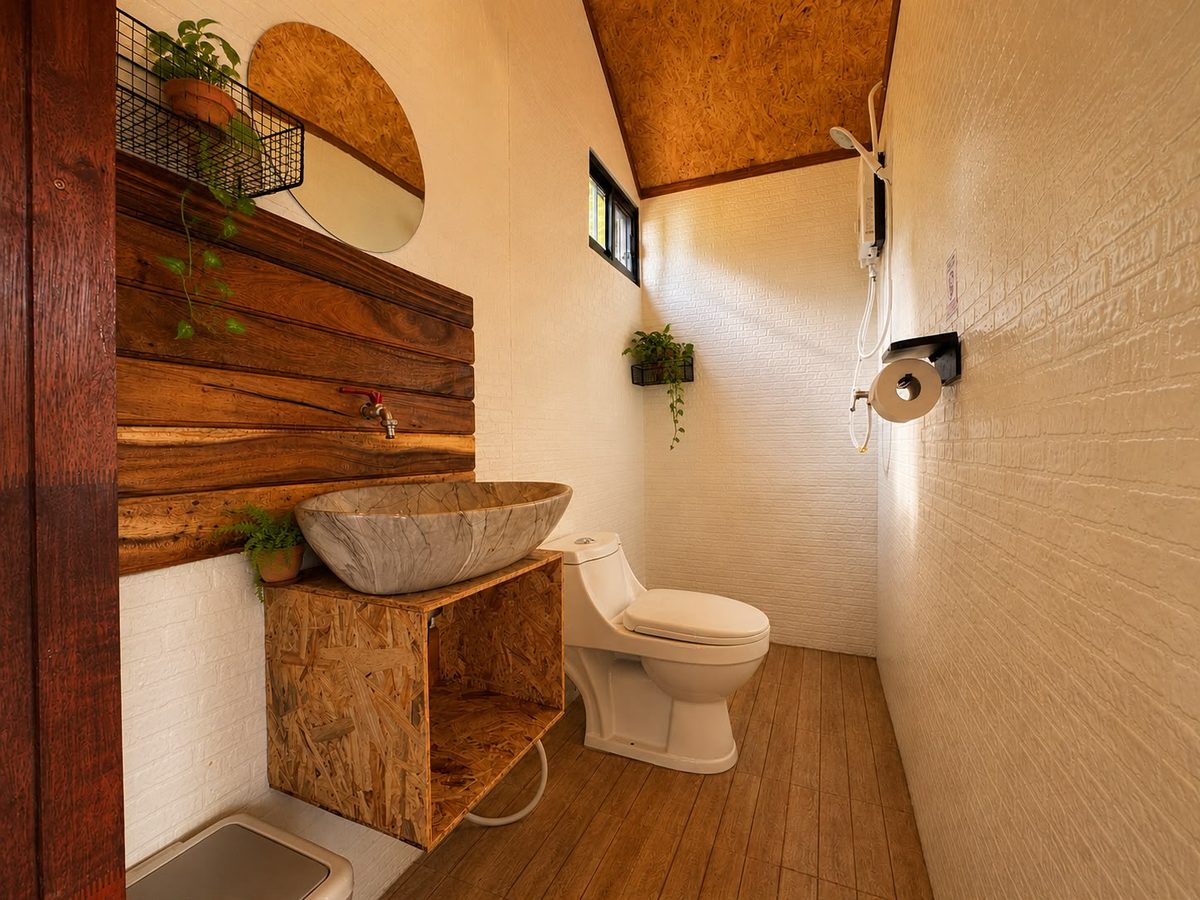 Private bathroom with stone sink and toilet