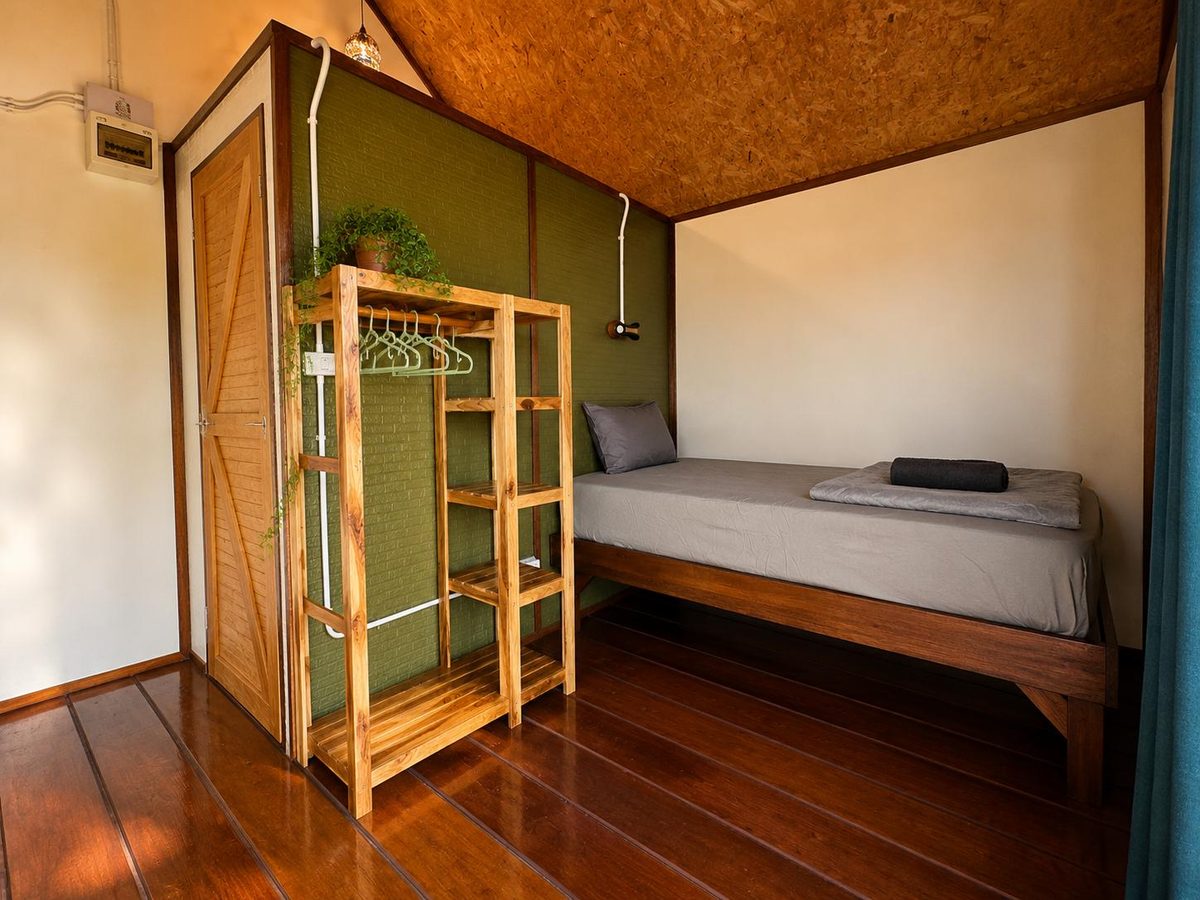 Bungalow bedroom with single bed and wooden floor